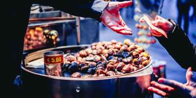 person paying bill in front of nuts