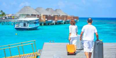 man and woman walks on dock