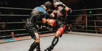 two fighter fighting inside ring