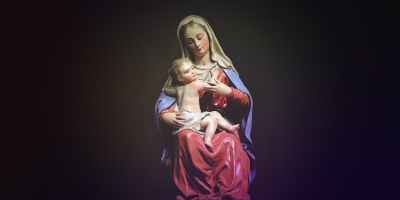 mother mary and christ figurine on black background