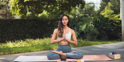 woman meditating outdoors
