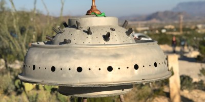 Old rusty UFO sculpture in a desert ghost town