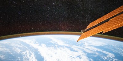 A starry sky above the Earth's atmospheric glow