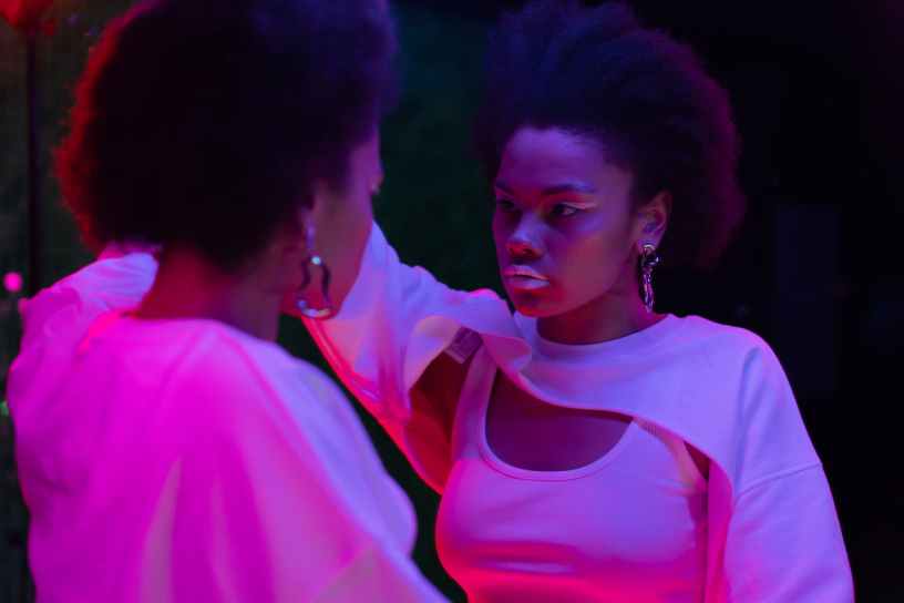 woman looking into a mirror