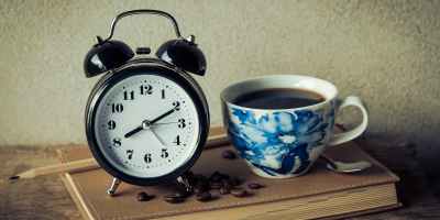 round black analog table alarm clock