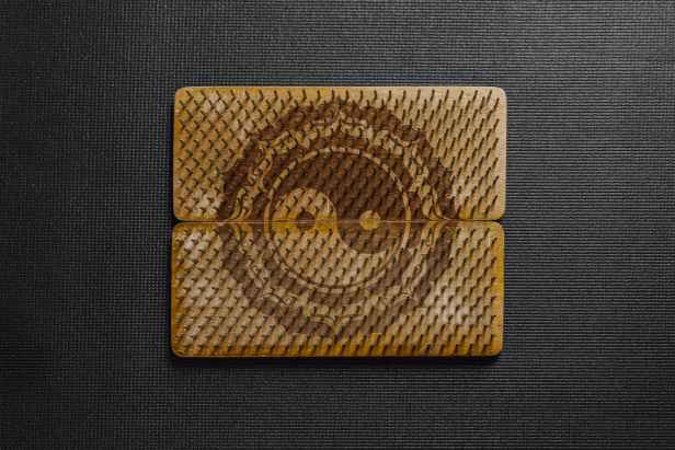 nails on wooden board with the ying yang symbol