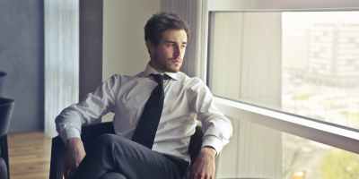 man wearing white dress shirt and black necktie