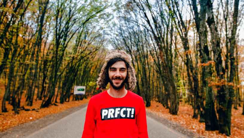 man wearing red crew neck sweater