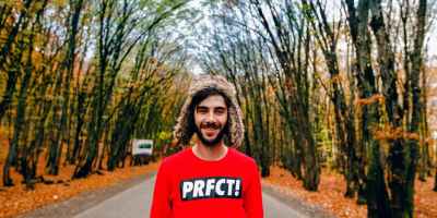 man wearing red crew neck sweater