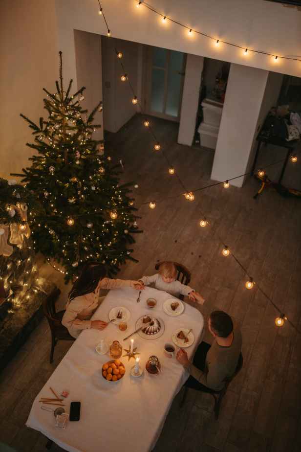 family holding hands around the dinner table