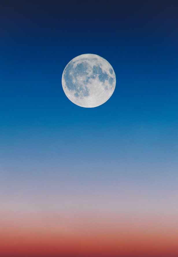 full moon on a blue sky